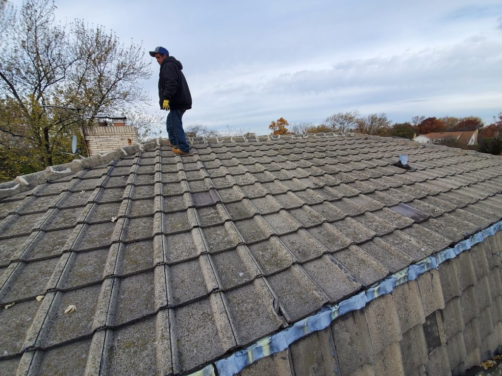 Concrete tile condition shown by Northbrook roofing contractor