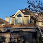 roofing contractor in itasca illinois removes old shingles and protects home